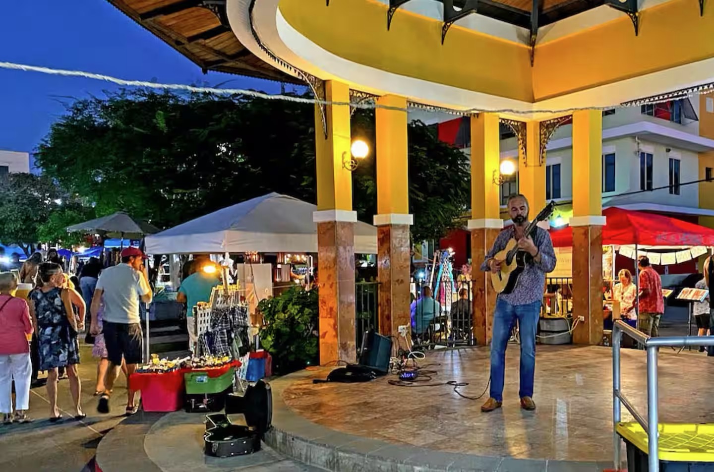Thursday art walk in Rincon town square with guitarist performing and local vendors